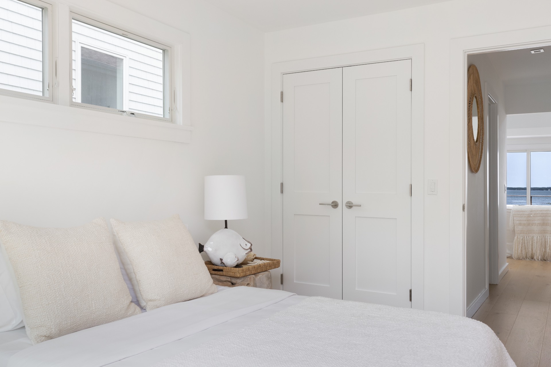 35 Hampton Road Sag Harbor, NY 11963 - Photo 21 of 27 a bedroom with a bed and a mirror