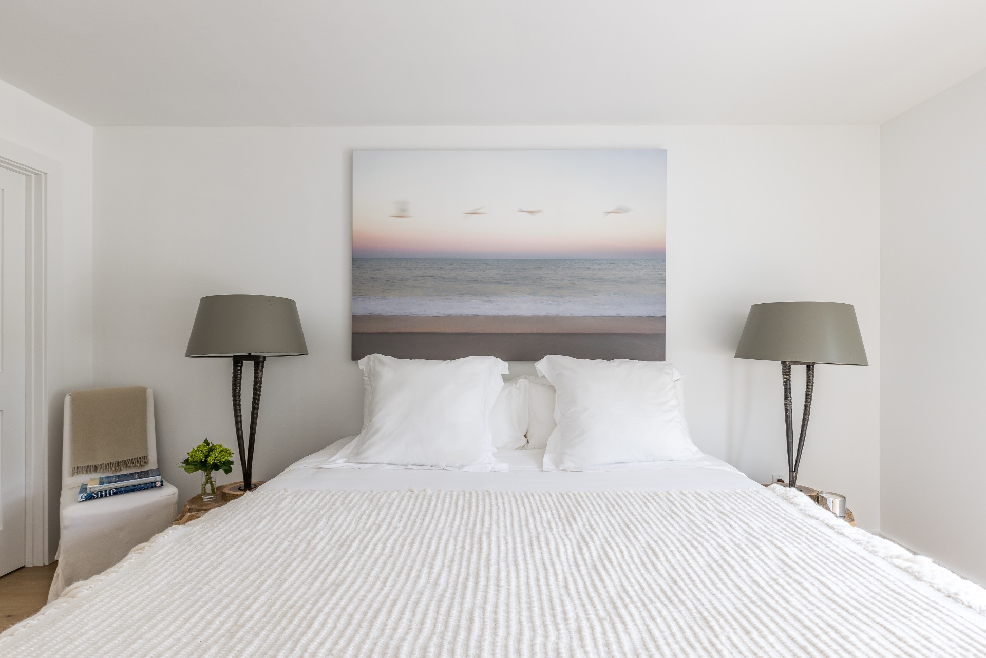 35 Hampton Road Sag Harbor, NY 11963 - Photo 22 of 27 a bedroom with a bed and a lamp