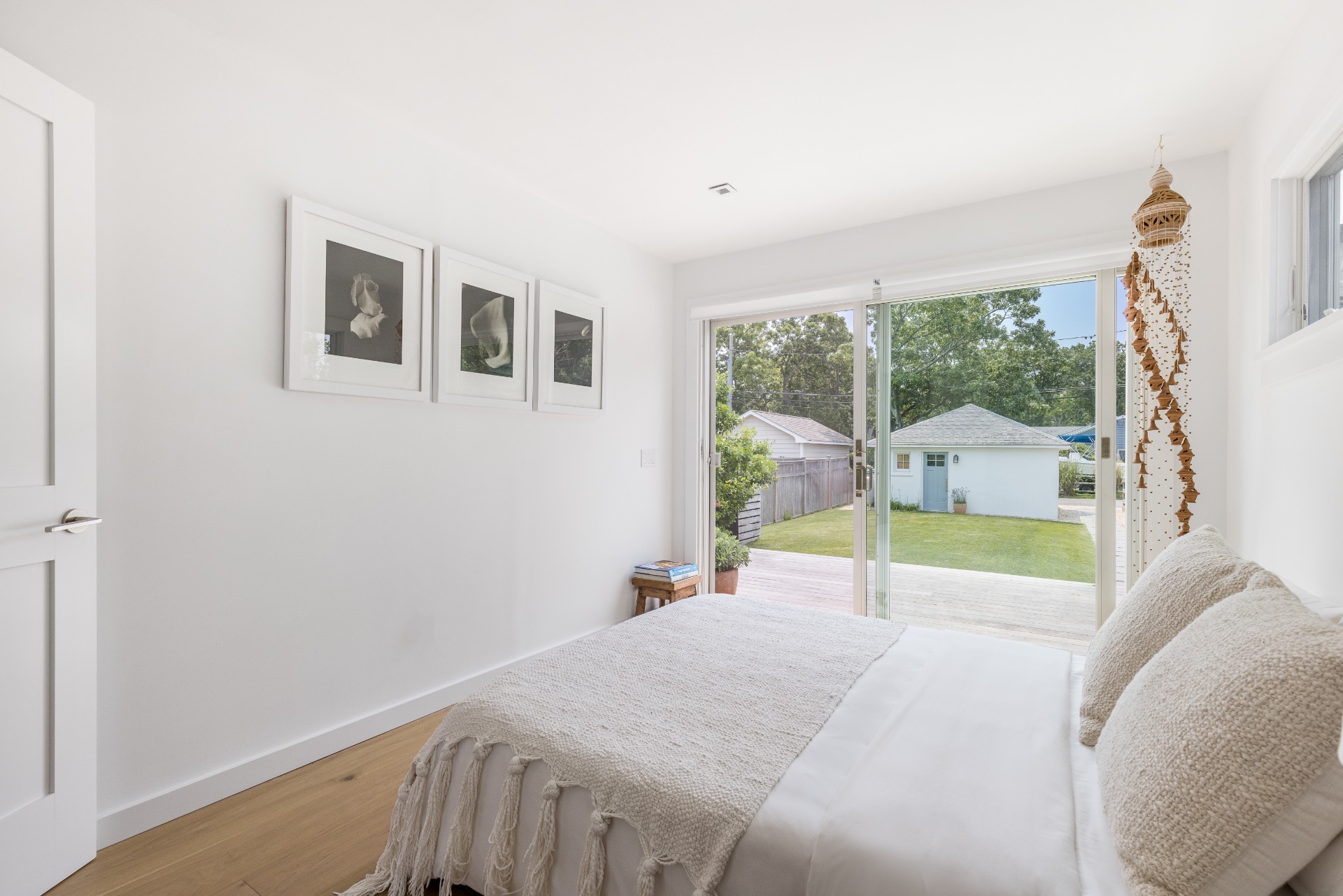 35 Hampton Road Sag Harbor, NY 11963 - Photo 23 of 27 a bedroom with a bed and a window