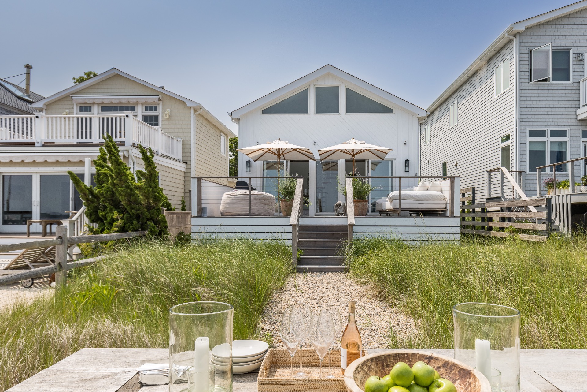 35 Hampton Road Sag Harbor, NY 11963 - Photo 3 of 27 a front view of a house with swimming pool having outdoor seating