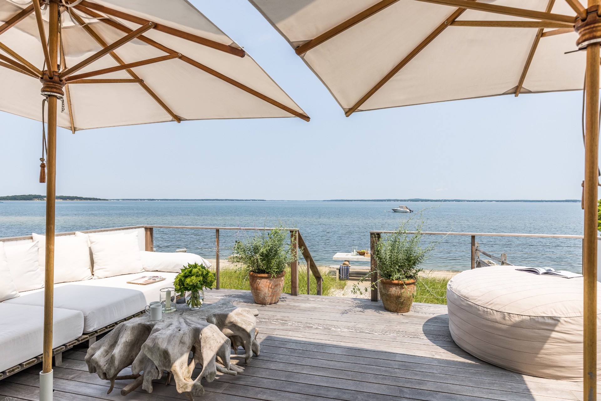 35 Hampton Road Sag Harbor, NY 11963 - Photo 9 of 27 a view of a balcony dining table and chairs