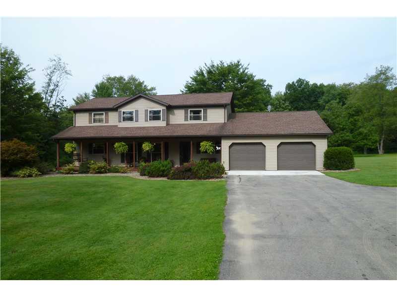 Exterior Front. Beautiful landscaping sets this home apart.