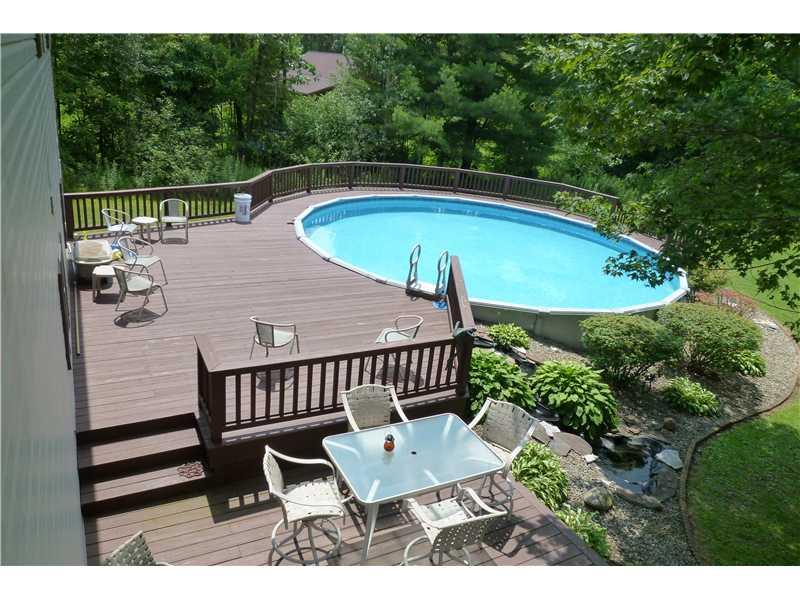 781 Henderson Station Road Stoneboro, PA 16153 - Photo 3 of 13 Swimming Pool/Hot Tub/Sauna. Large decks provide lots of room for parties around the pool.