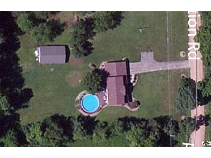 781 Henderson Station Road Stoneboro, PA 16153 - Photo 4 of 13 Aerial View. Wooded acreage extends approximately 1400 feet from the road..