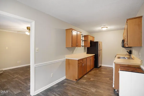 a kitchen with a stove and a refrigerator