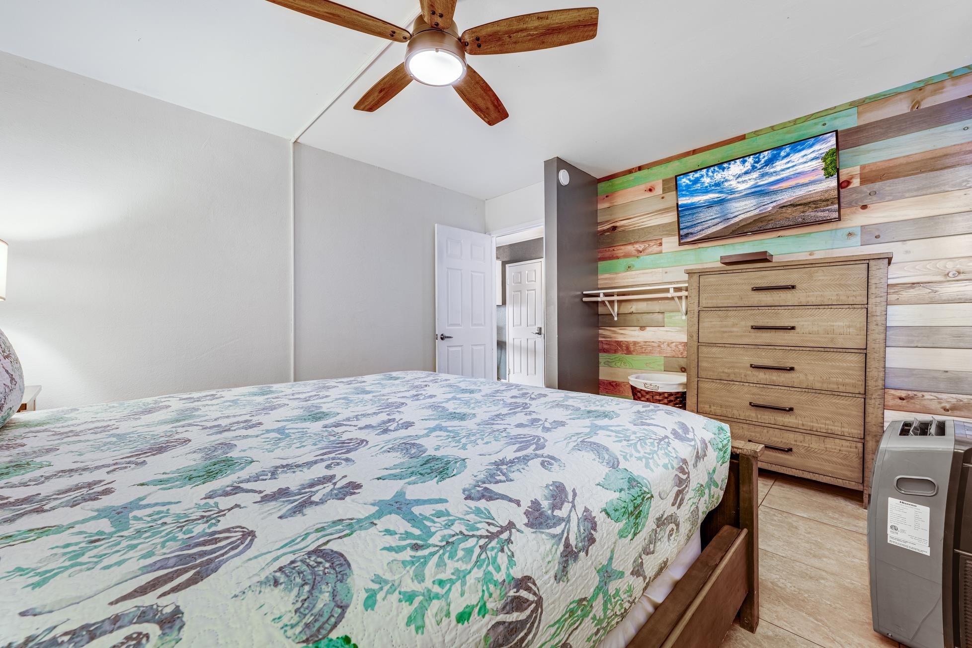 1993 South Kihei Road, Unit 311 Kihei, HI 96753 - Photo 14 of 31 a bedroom with a bed and a walk in closet