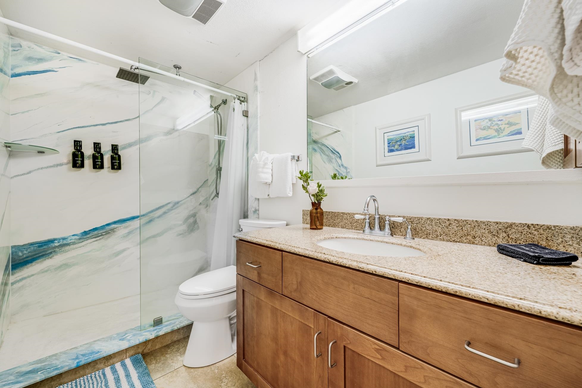 1993 South Kihei Road, Unit 311 Kihei, HI 96753 - Photo 15 of 31 a bathroom with a sink a toilet and shower