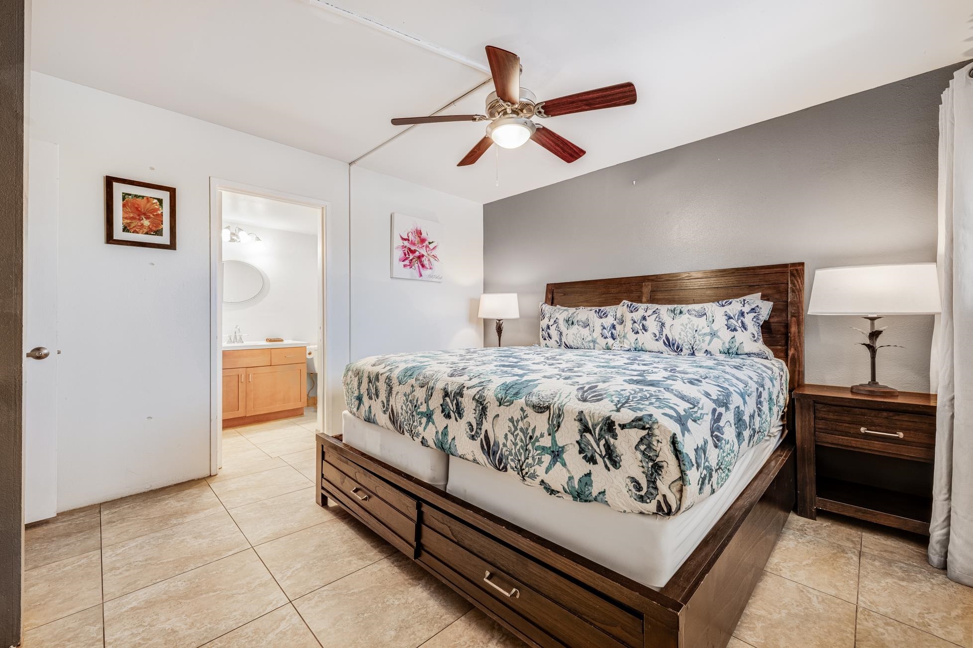 1993 South Kihei Road, Unit 311 Kihei, HI 96753 - Photo 16 of 31 a bedroom with a bed and a ceiling fan