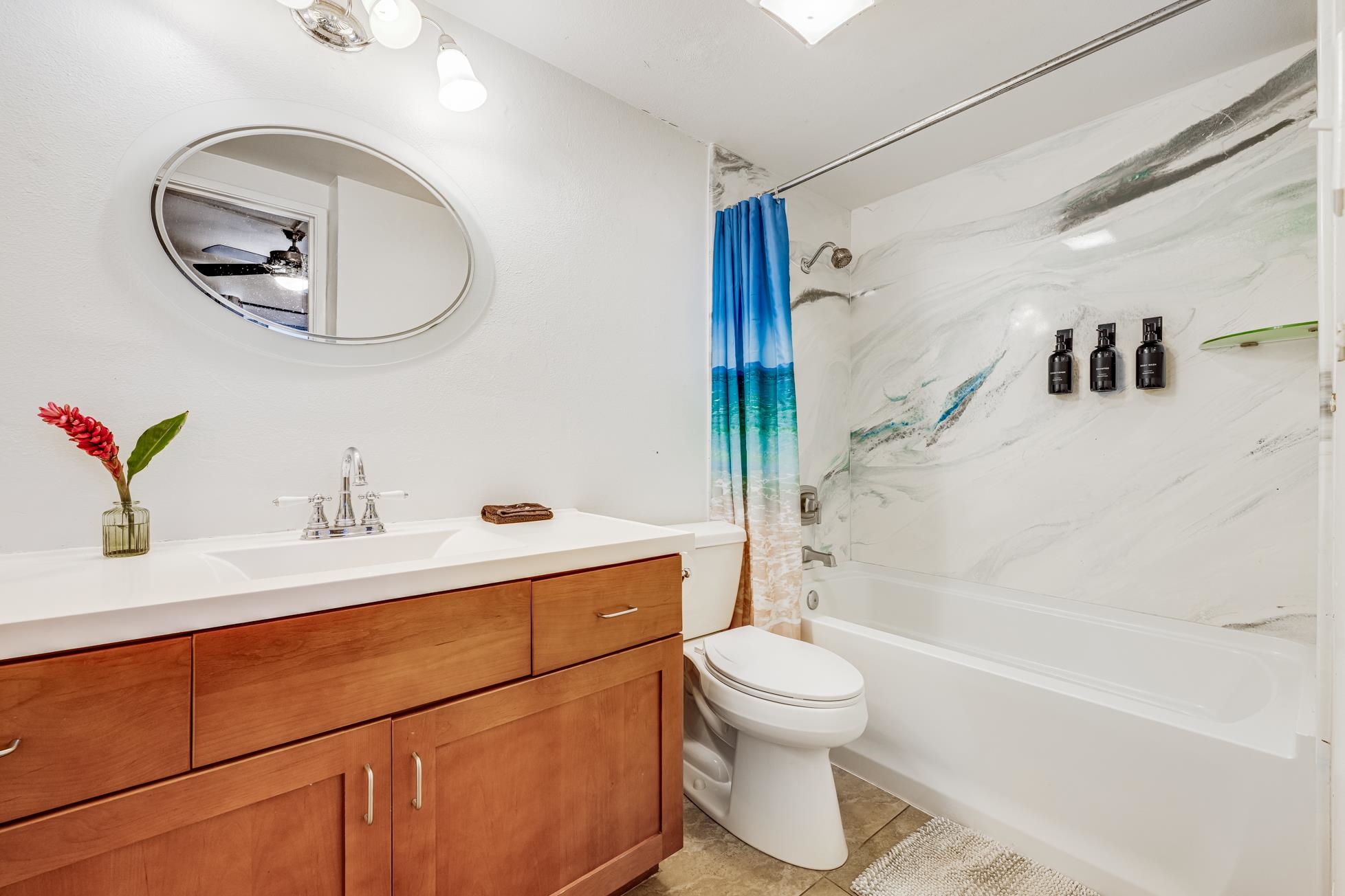 1993 South Kihei Road, Unit 311 Kihei, HI 96753 - Photo 19 of 31 a bathroom with a sink toilet and shower