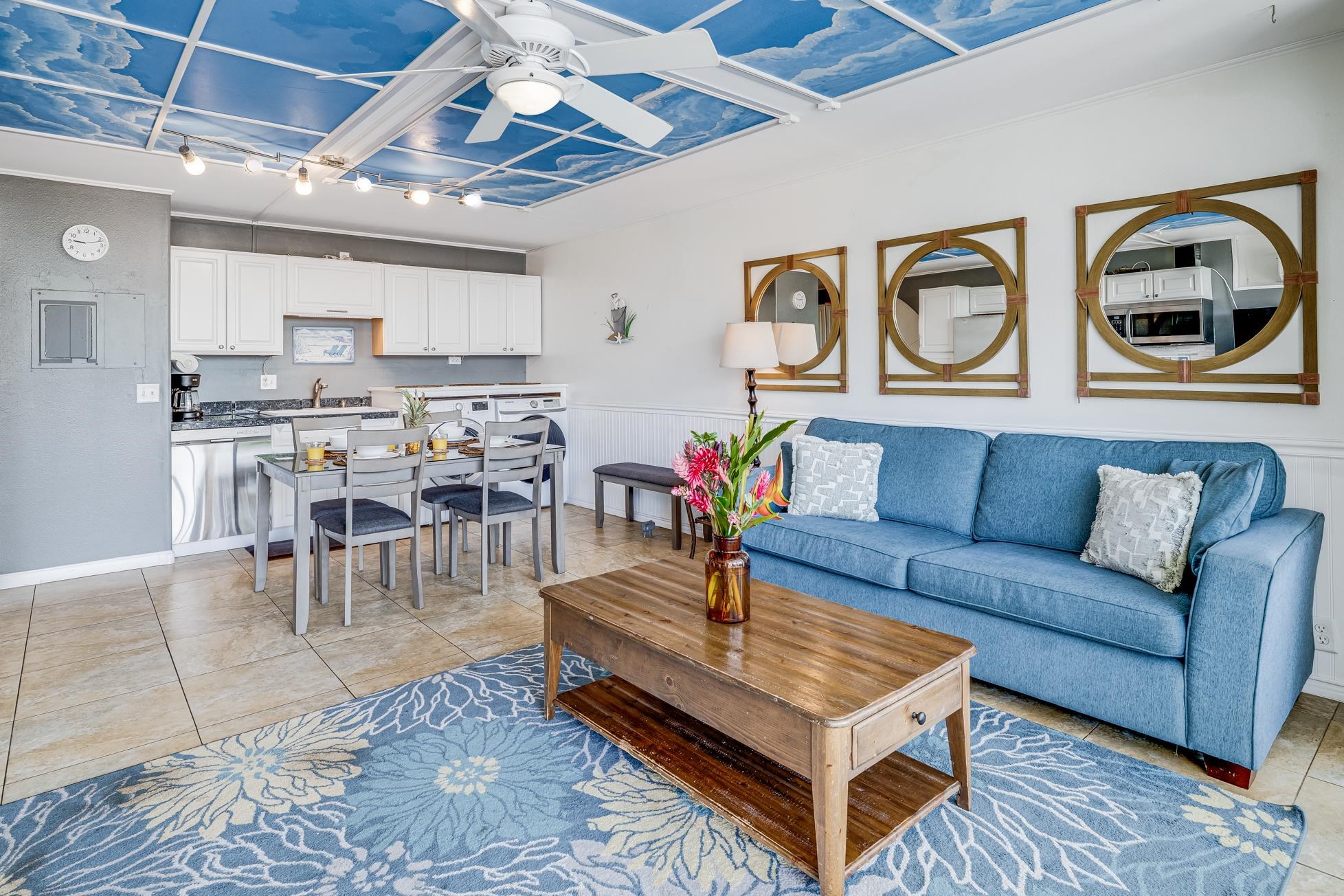 1993 South Kihei Road, Unit 311 Kihei, HI 96753 - Photo 3 of 31 a living room with furniture and a chandelier
