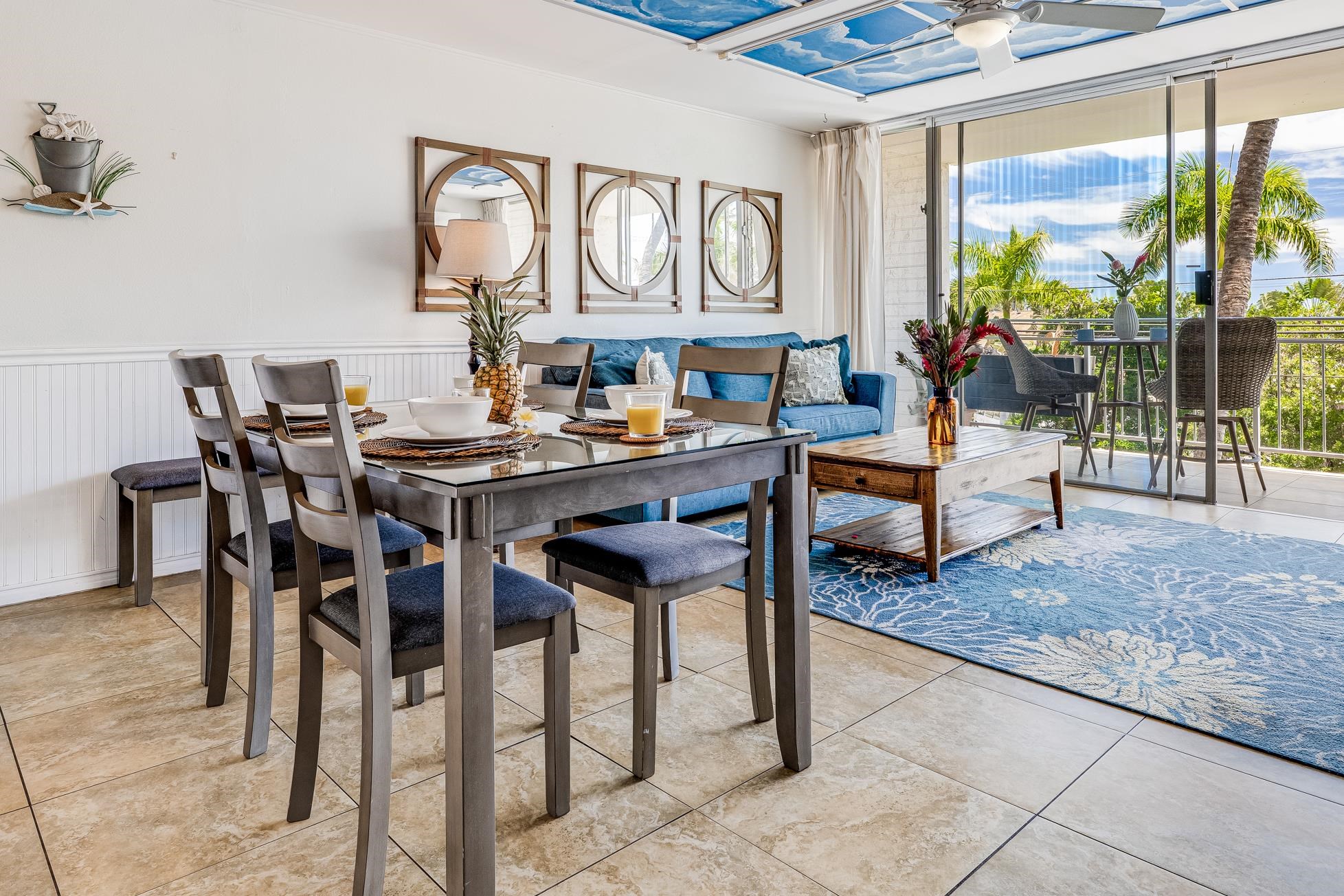 1993 South Kihei Road, Unit 311 Kihei, HI 96753 - Photo 5 of 31 a view of a dining area with furniture and chandelier