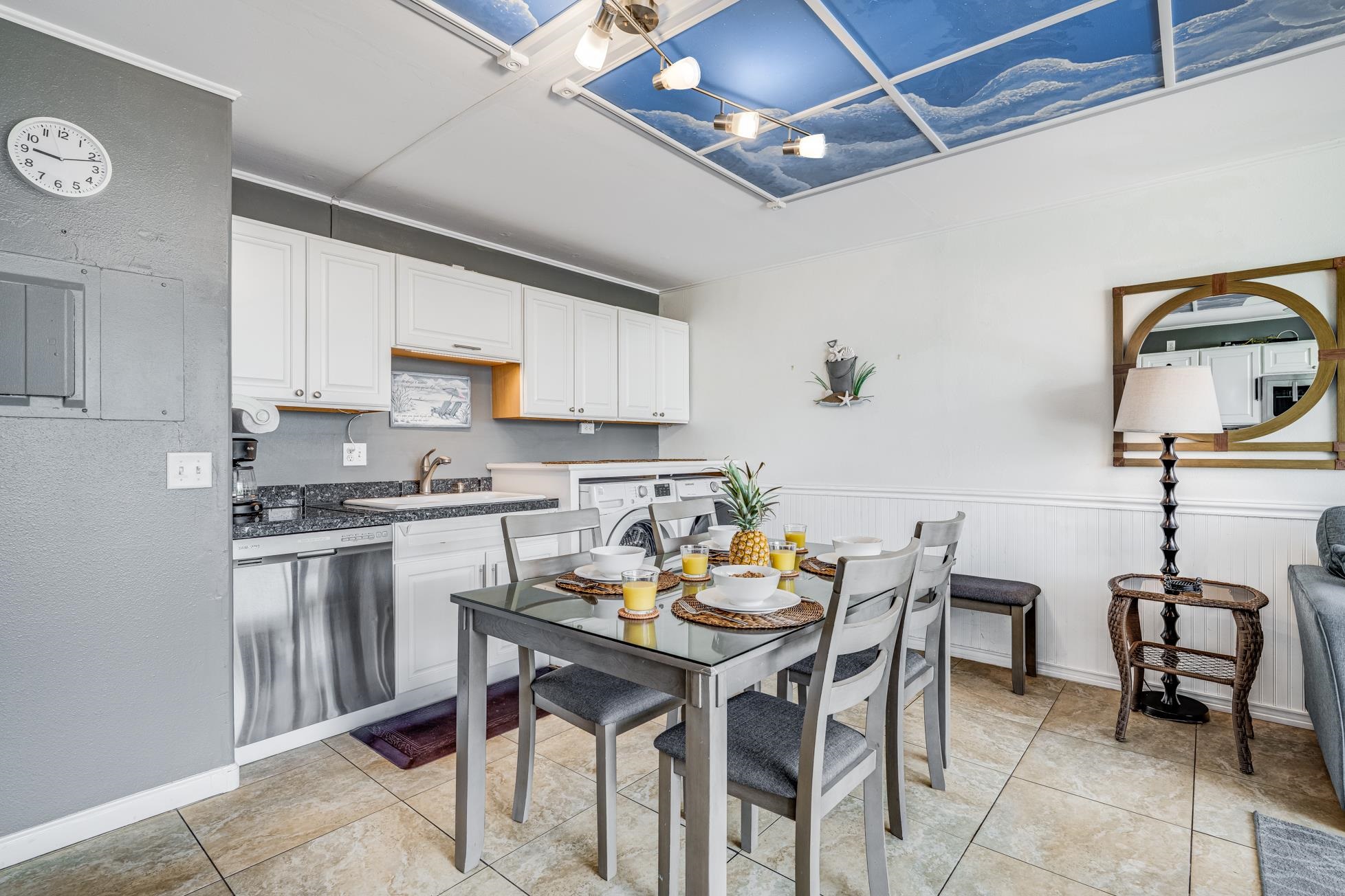 1993 South Kihei Road, Unit 311 Kihei, HI 96753 - Photo 8 of 31 a kitchen with stainless steel appliances granite countertop a stove top oven a sink a dining table and chairs