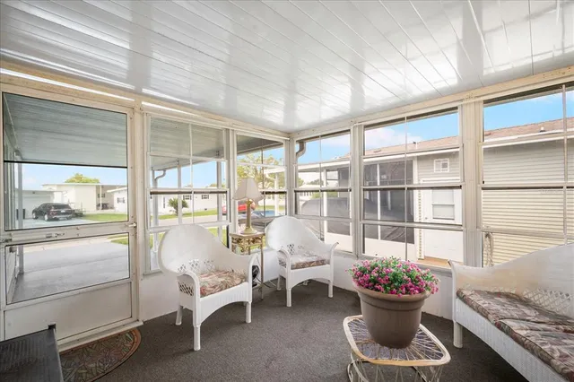 a room with furniture and flowers