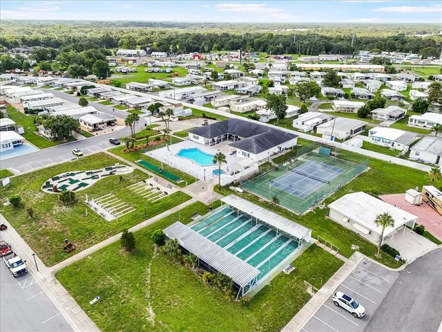 a view of a backyard with a sitting area