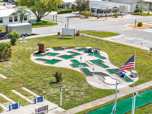 a view of a swimming pool with lounge chair