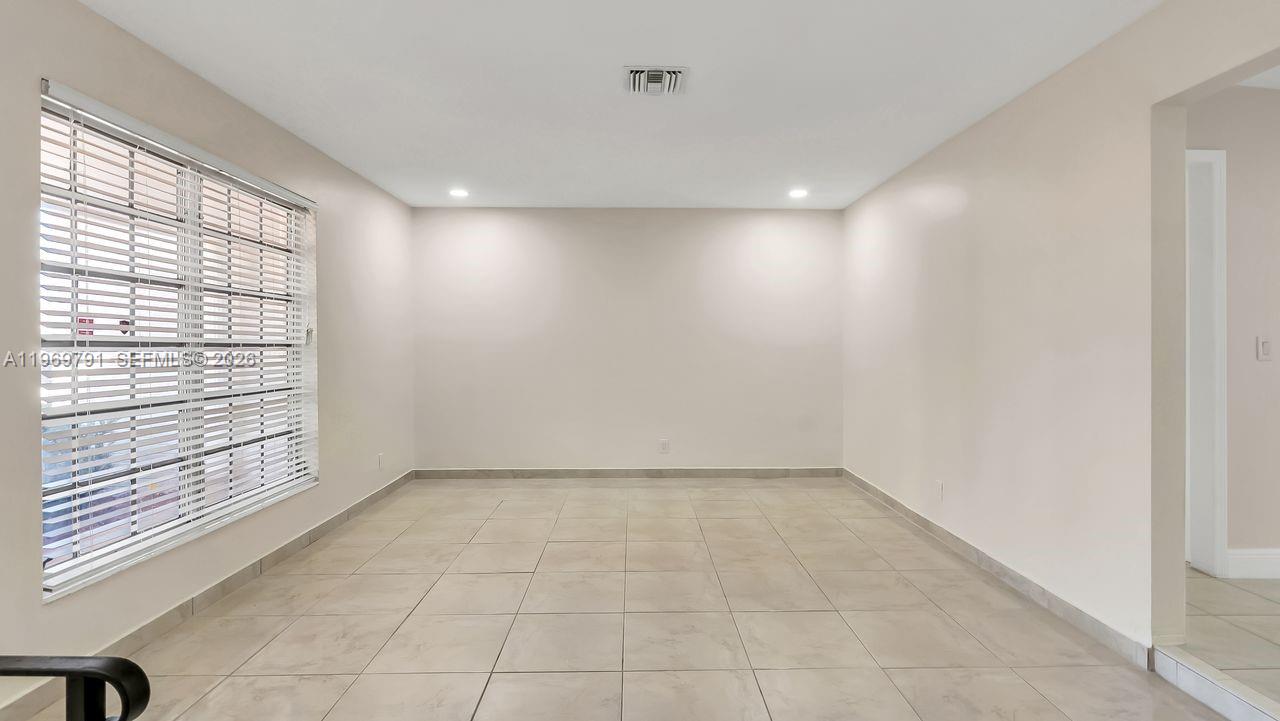 5300 Grant Street Hollywood, FL 33021 - Photo 13 of 46 a view of an empty room with a window