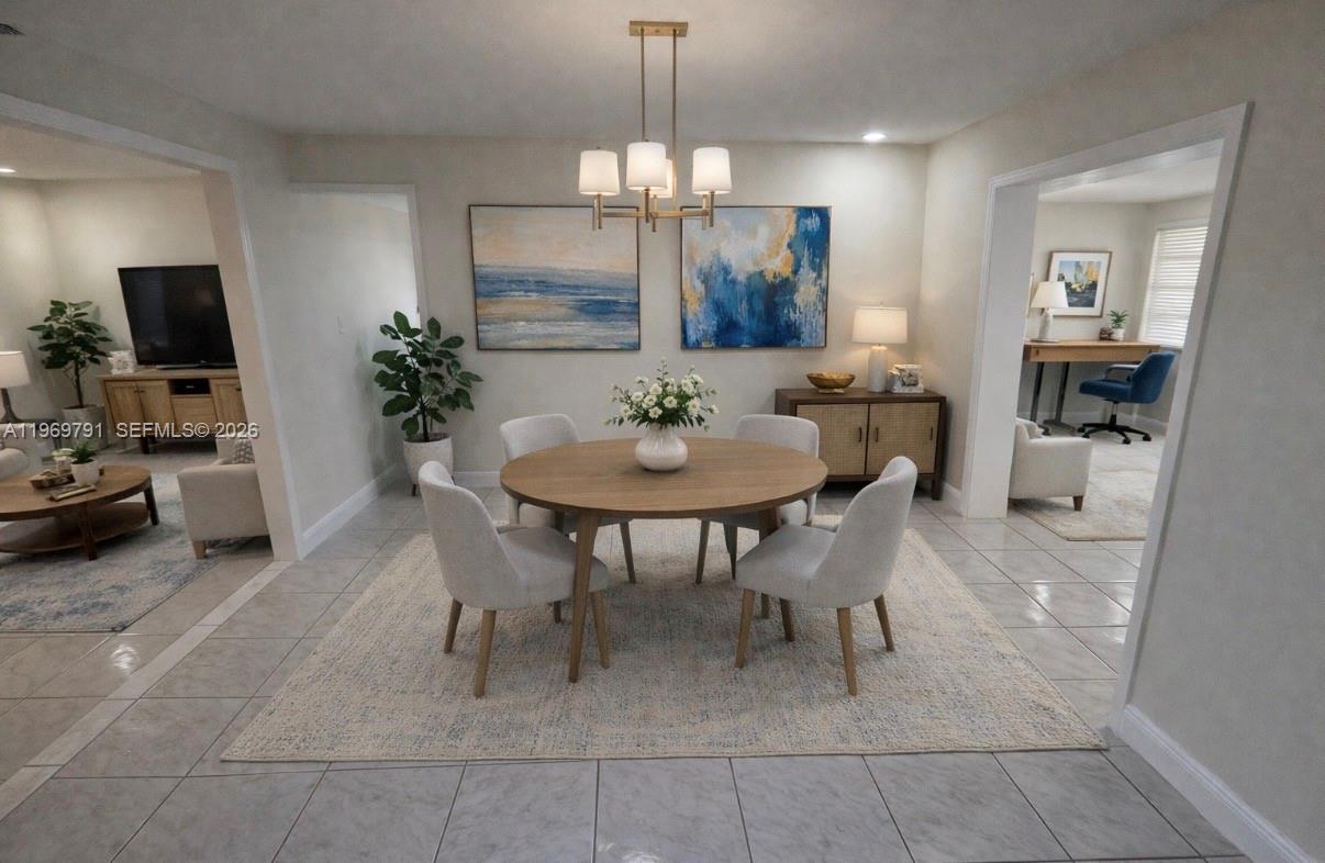 5300 Grant Street Hollywood, FL 33021 - Photo 15 of 46 a view of a dining room with furniture and wooden floor
