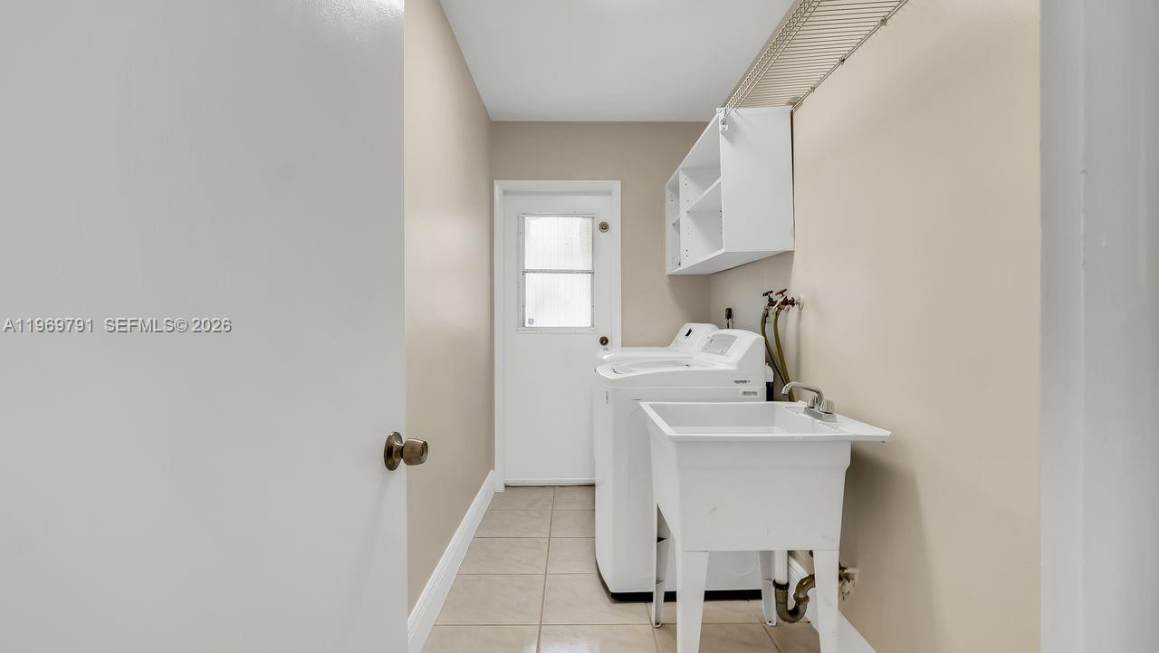 5300 Grant Street Hollywood, FL 33021 - Photo 24 of 46 a bathroom with a sink a mirror and a toilet