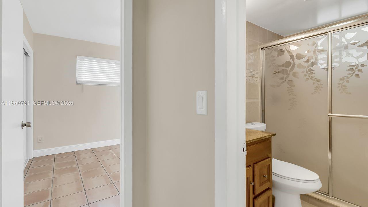 5300 Grant Street Hollywood, FL 33021 - Photo 30 of 46 a white toilet sitting next to a bathroom sink