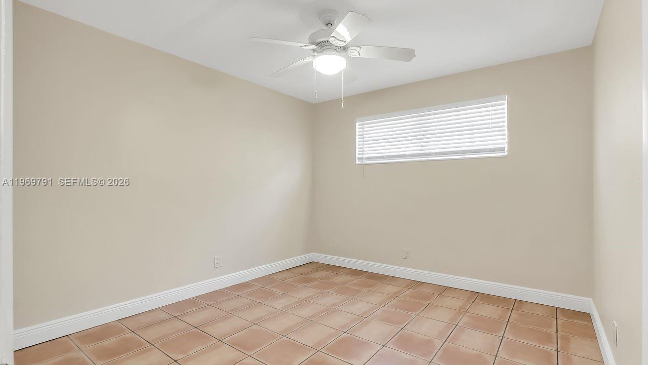 5300 Grant Street Hollywood, FL 33021 - Photo 32 of 46 an empty room with windows and fan