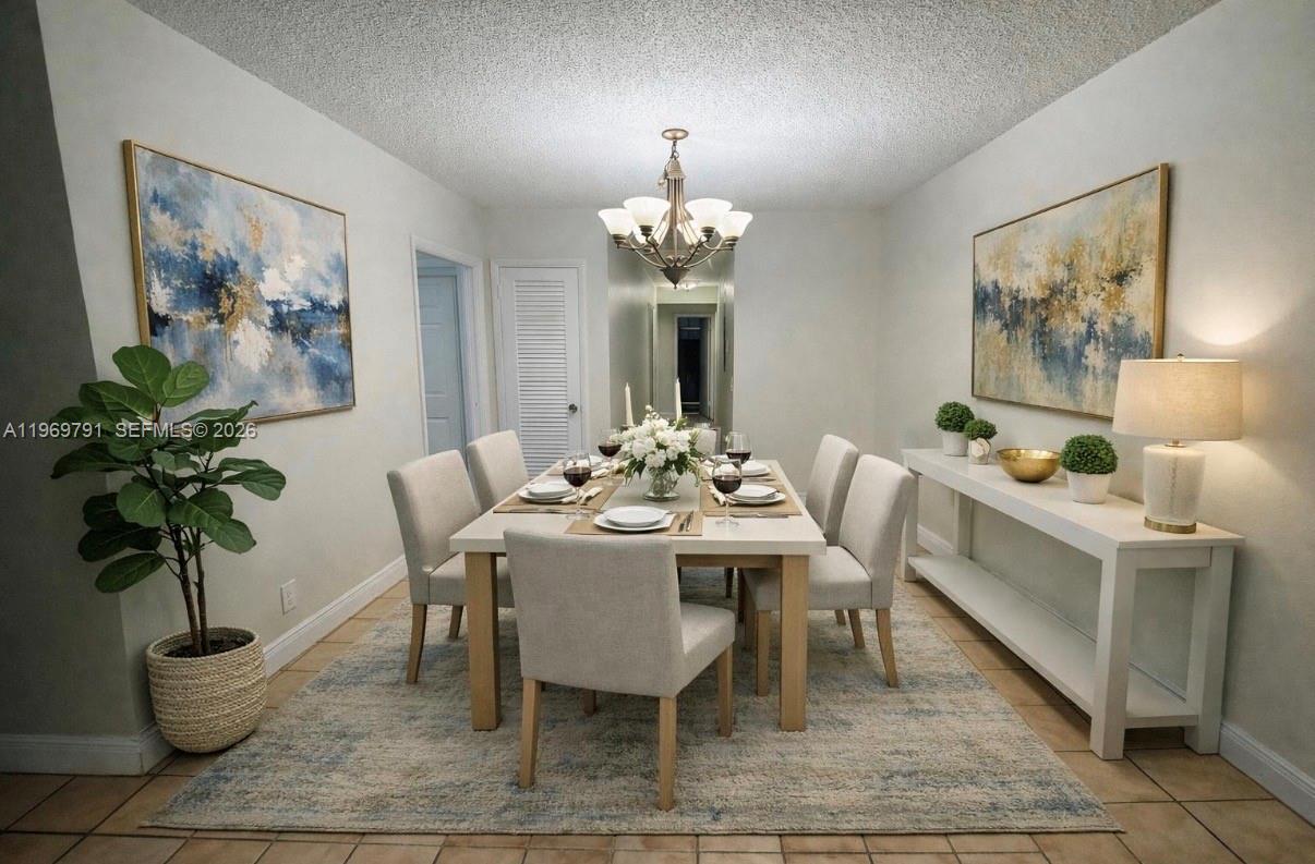5300 Grant Street Hollywood, FL 33021 - Photo 34 of 46 a dining room with furniture potted plants and wooden floor