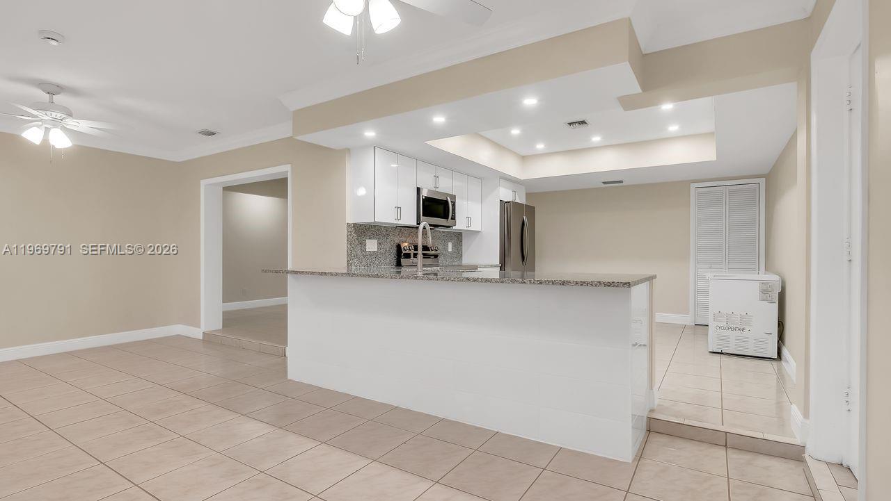 5300 Grant Street Hollywood, FL 33021 - Photo 10 of 46 a view of kitchen with refrigerator and window