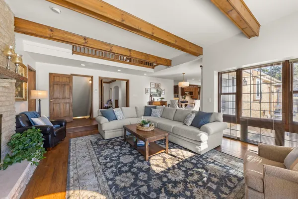 a living room with furniture or couch and a large window