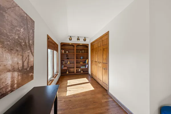 a view of an empty room with a fireplace