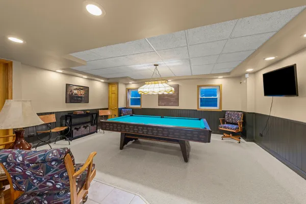 a room with furniture and a flat screen tv