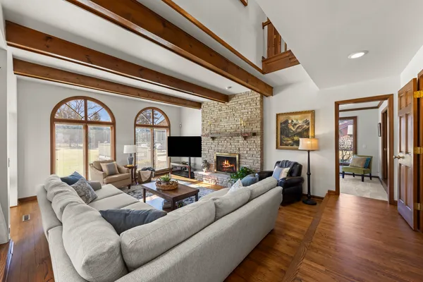 a living room with furniture and a fireplace