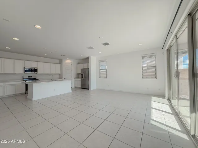 a view of kitchen electric appliances cabinets and furniture