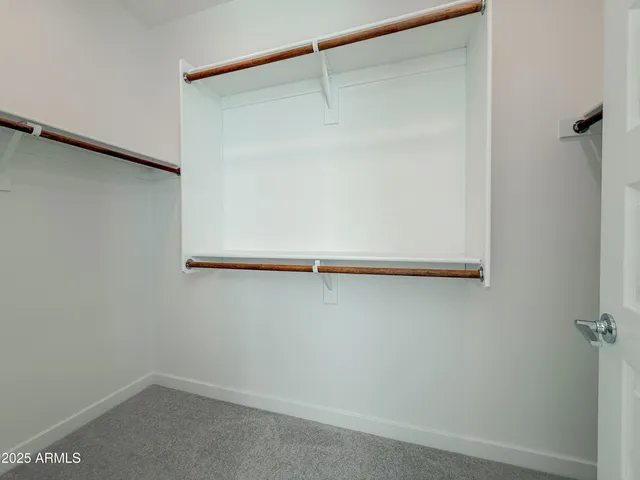 a spacious bathroom with a vanity and a mirror