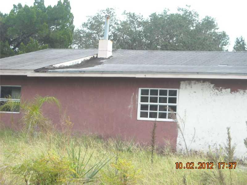 6308 Stone Road Port Richey, FL 34668 - Photo 1 of 1 Exterior Front - Value is in the .7 acre parcel and not the sttucture.