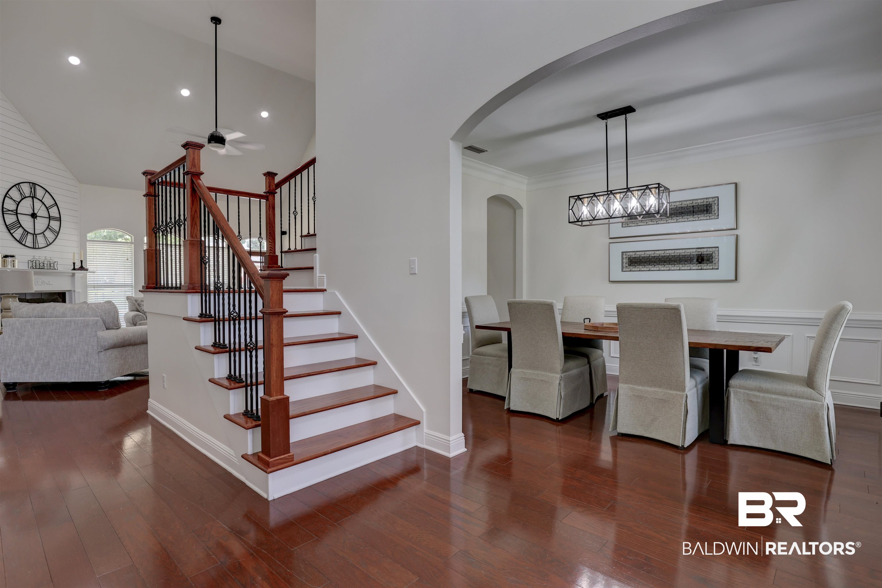 5565 Dawes Lane Theodore, AL 36582 - Photo 3 of 38 Dining room with crown molding, dark wood-type flooring, lofted ceiling, and a chandelier