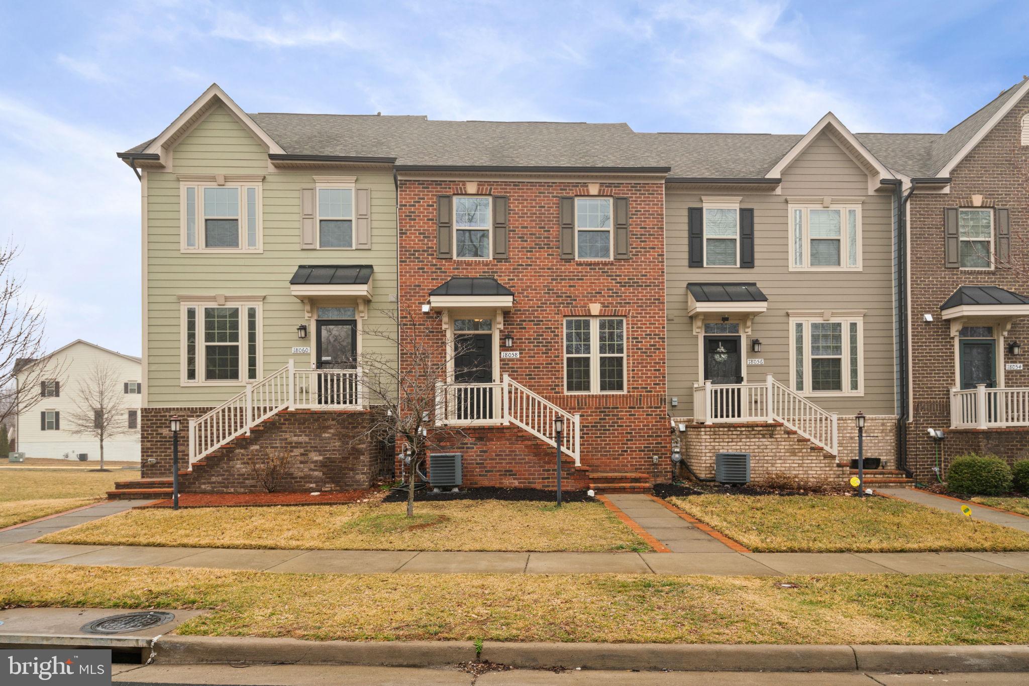 A Brick Front Townhouse w/2 Car Garage!