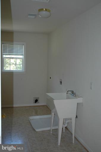 6931 North Stuart Road King George, VA 22485 - Photo 7 of 30 a bathroom with a sink and a bathtub
