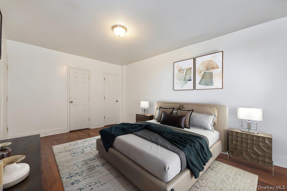 3840 Greystone Avenue, Unit 5O Bronx, NY 10463 - Photo 4 of 7 Bedroom with dark wood finished floors and baseboards