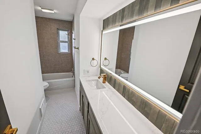 a bathroom with a tub and shower