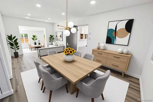 a view of a dining room with furniture and wooden floor