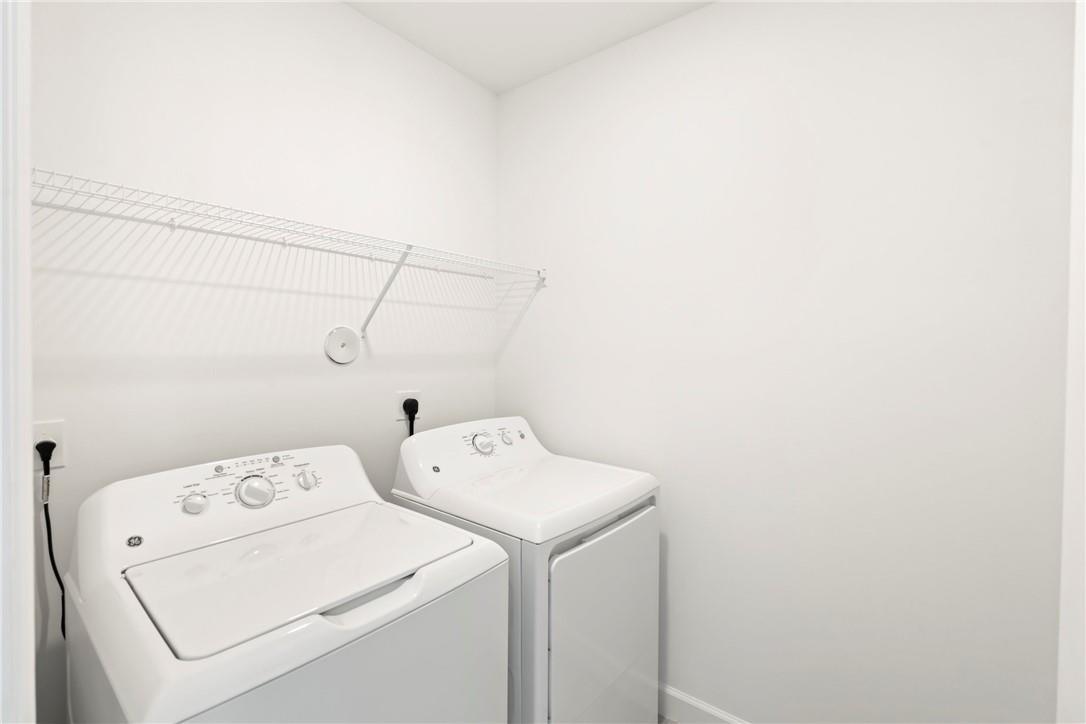 5653 Stradella Drive Boca Raton, FL 33433 - Photo 12 of 26 a utility room with dryer and washer