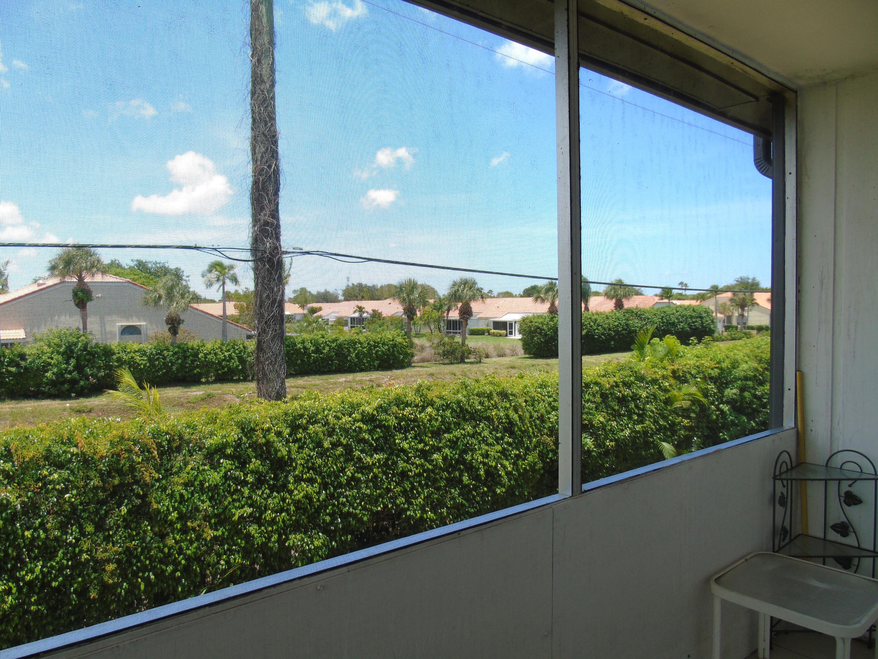 219 Normandy Lane Delray Beach, FL 33484 - Photo 20 of 33 a view of a garden from a window