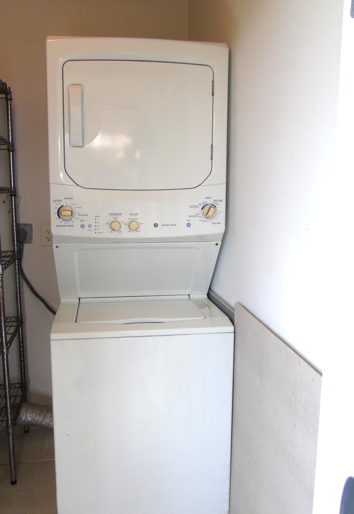219 Normandy Lane Delray Beach, FL 33484 - Photo 22 of 33 a close view of washer and dryer