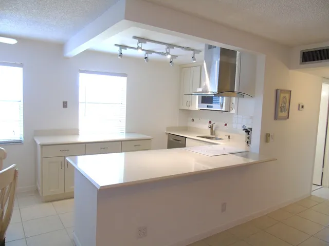a bathroom with a sink vanity and mirror