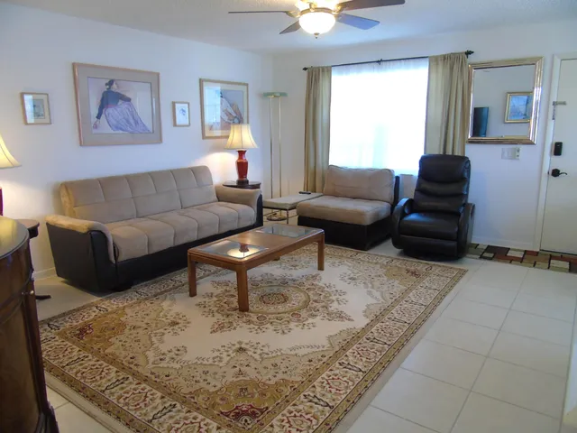 a living room with furniture and a rug