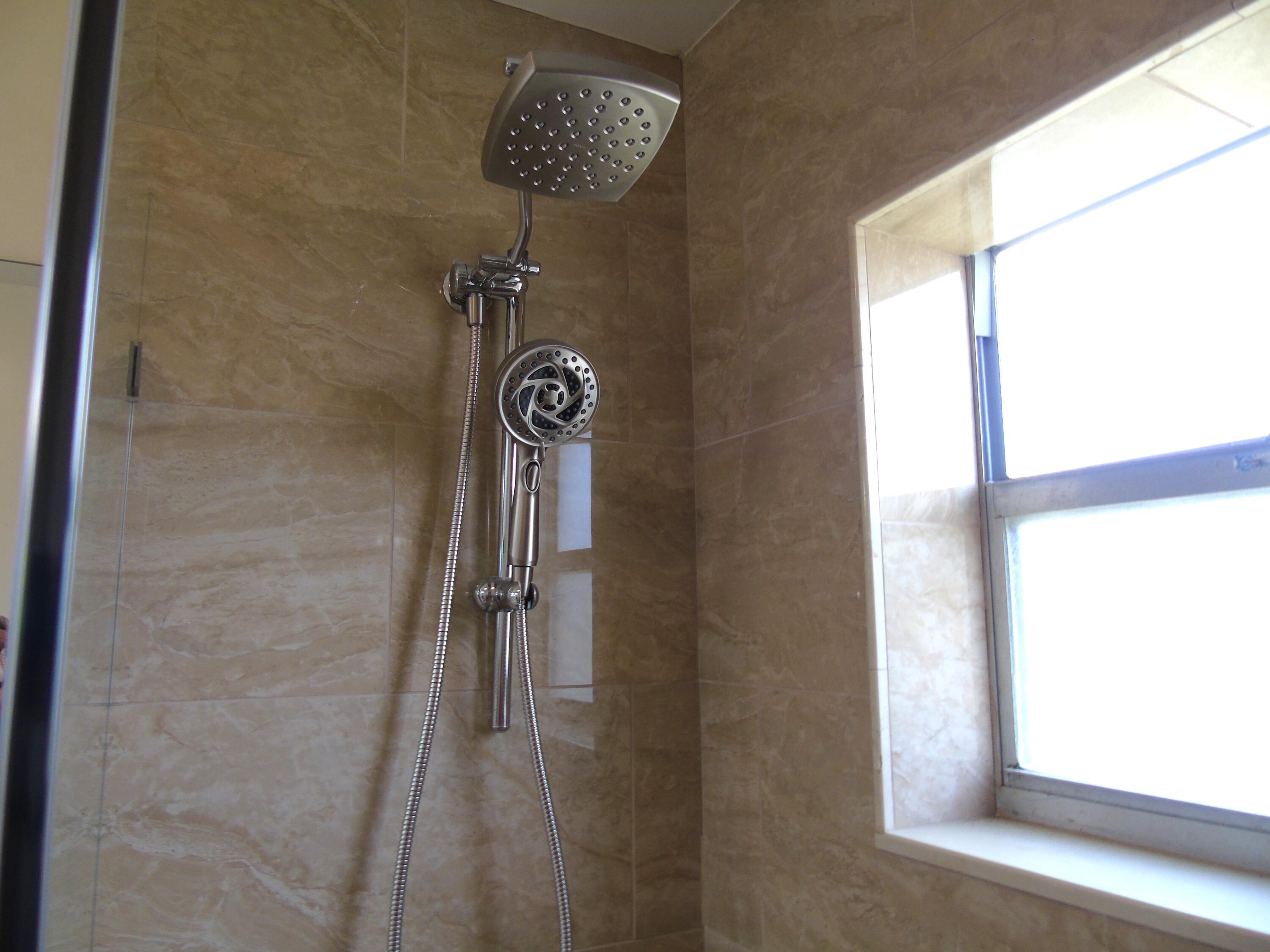 219 Normandy Lane Delray Beach, FL 33484 - Photo 10 of 33 a close up of a shower
