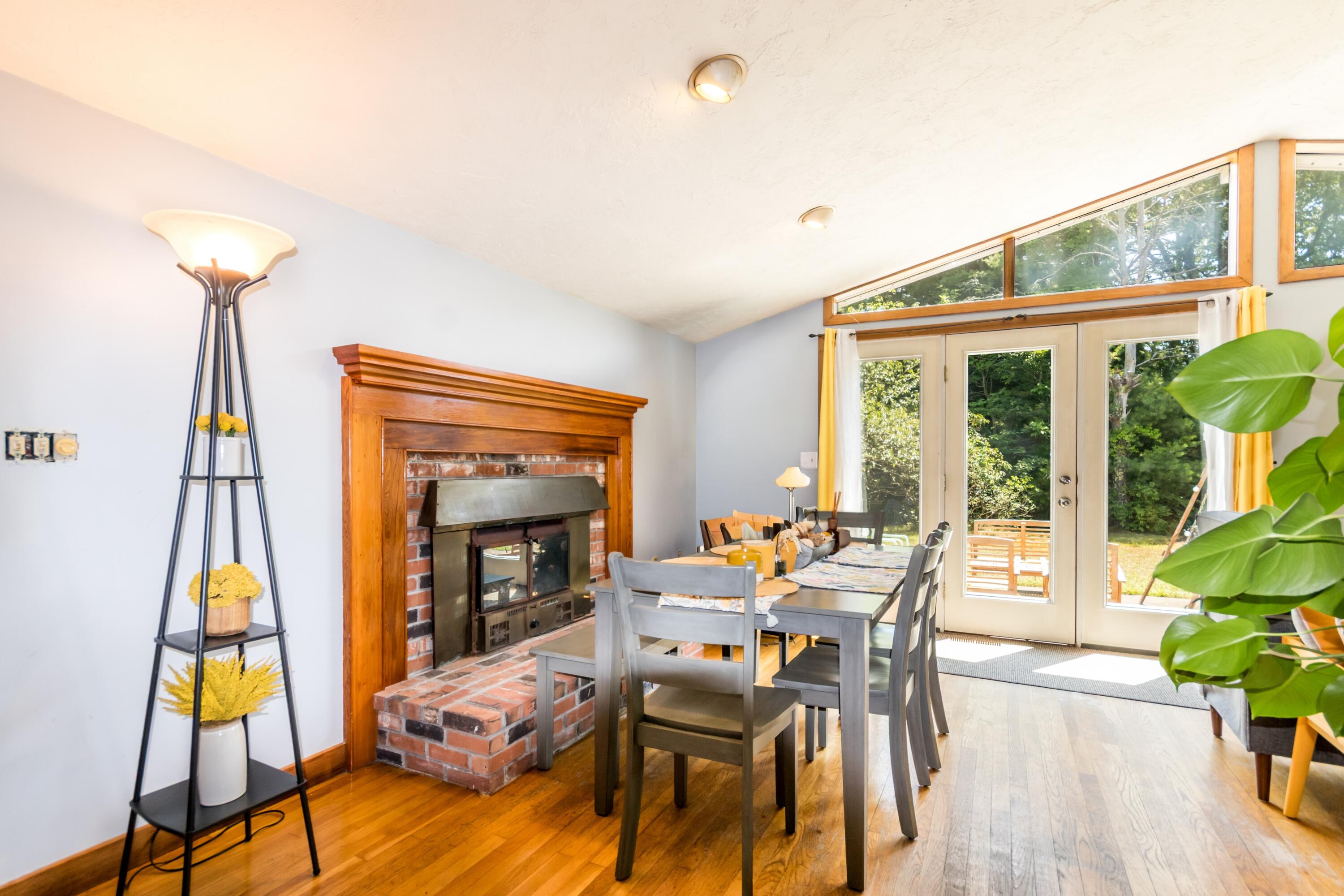32 North Carver Road West Wareham, MA 02576 - Photo 11 of 42 a dining room with furniture and a floor to ceiling window