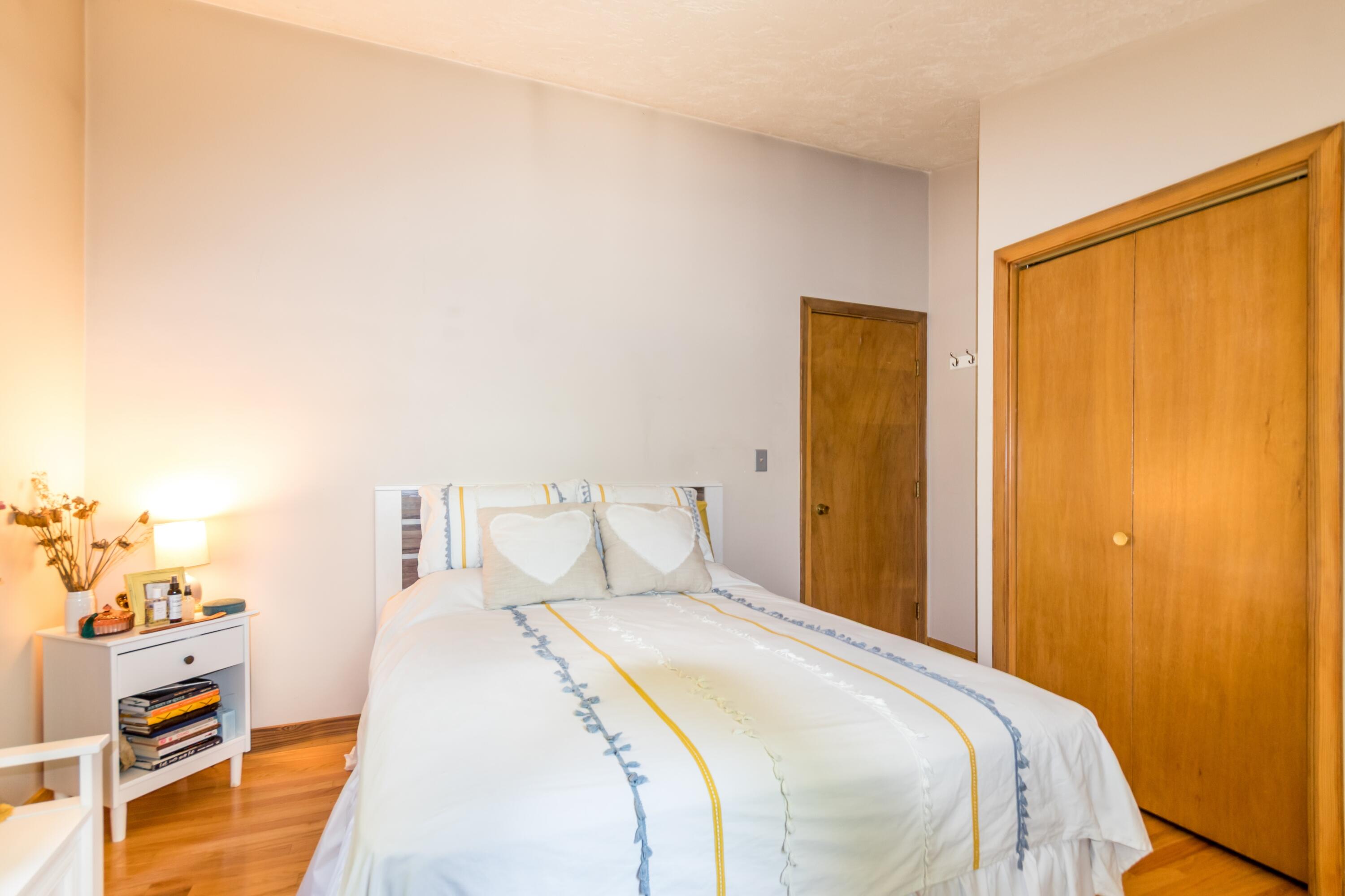 32 North Carver Road West Wareham, MA 02576 - Photo 16 of 42 a bedroom with a bed and a painting on the wall