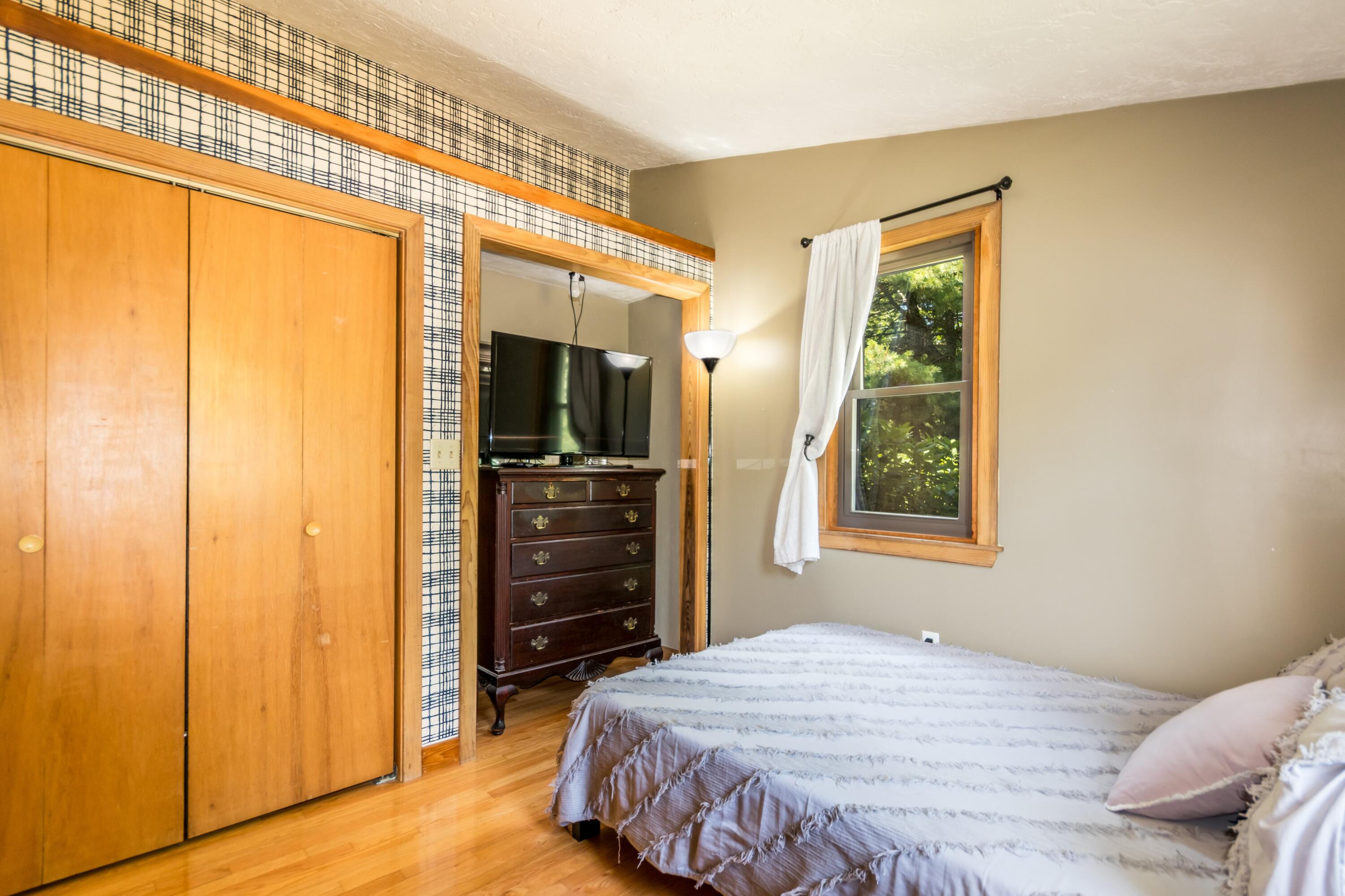 32 North Carver Road West Wareham, MA 02576 - Photo 19 of 42 a bedroom with a bed and a dresser