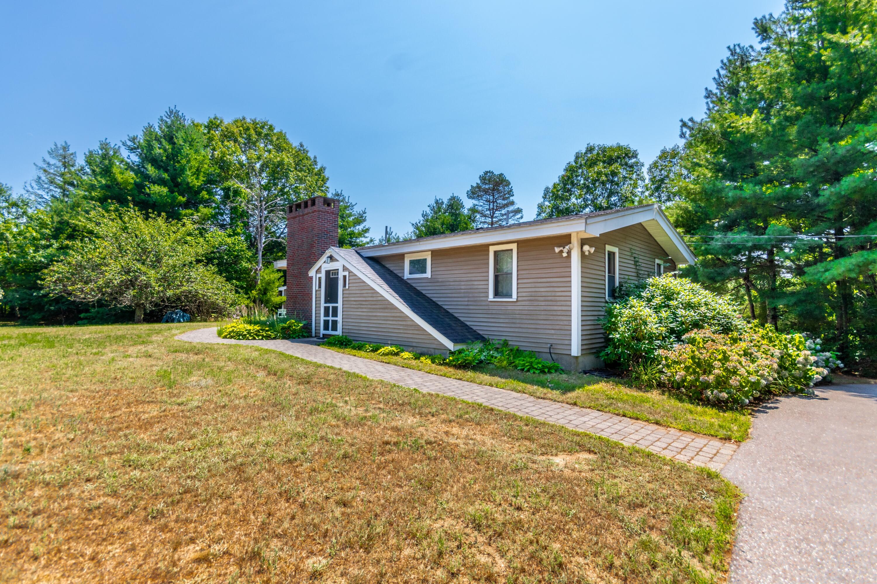 32 North Carver Road West Wareham, MA 02576 - Photo 22 of 42 a view of a house with a yard and potted plants