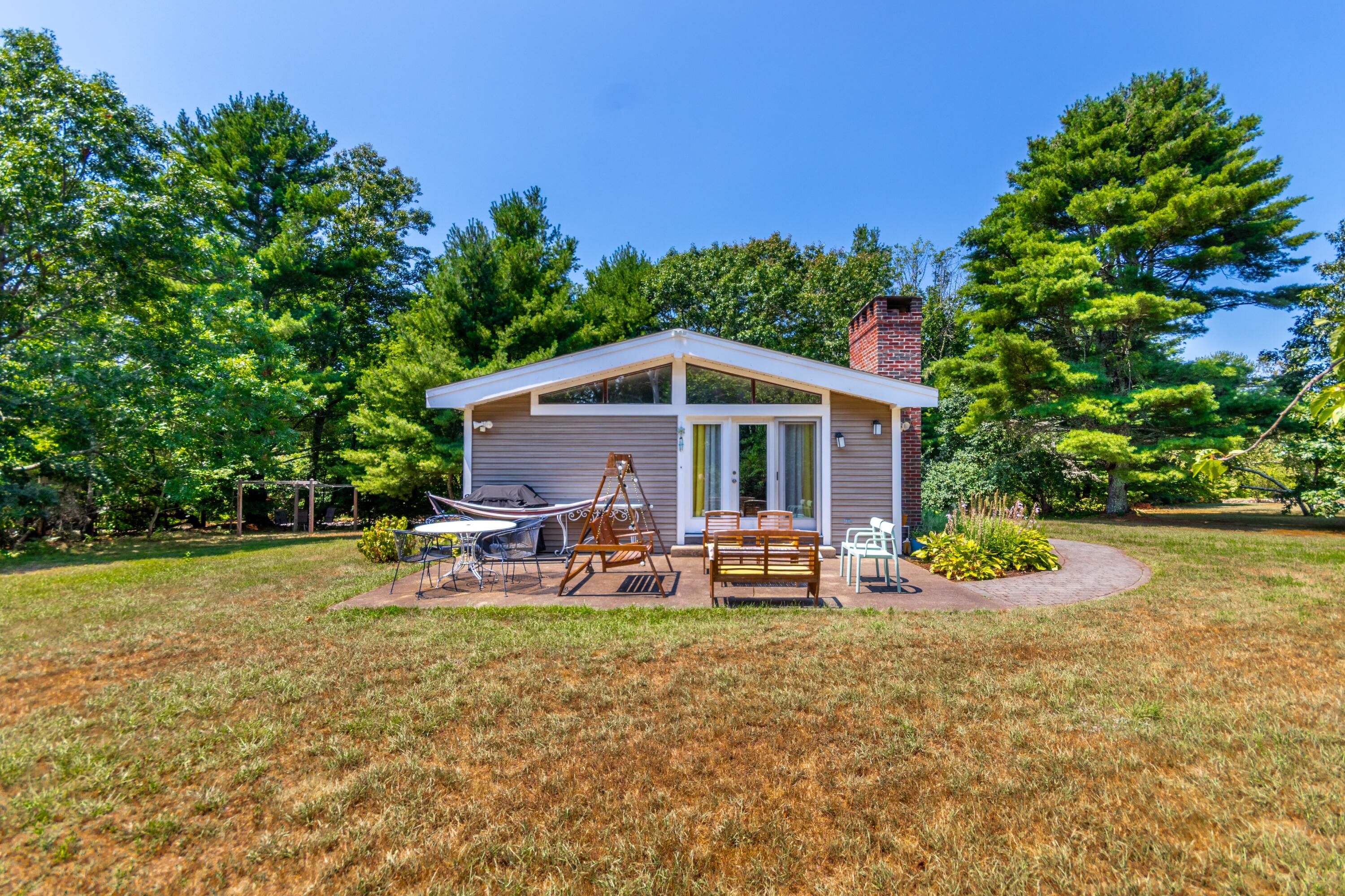 32 North Carver Road West Wareham, MA 02576 - Photo 25 of 42 a view of backyard with outdoor seating and green space
